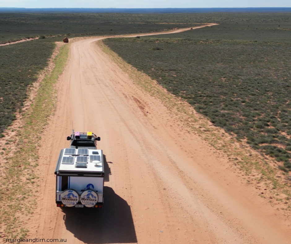 Our van heading down a dirt road in the outback