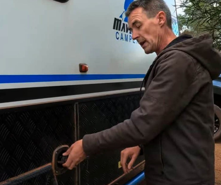 Tim checking the van's storage locker